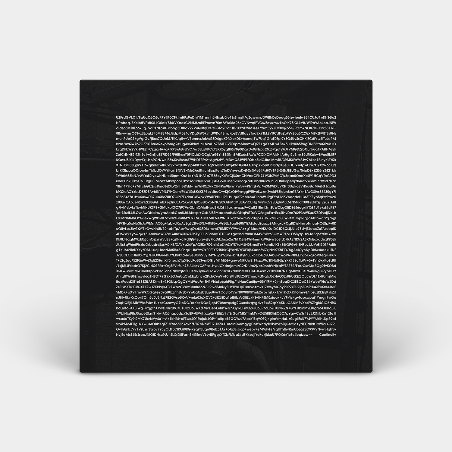 The album cover for 'Continuity' by Yann Novak, made to look 3D with shadows on a light grey background. The cover is a dark grey photo background of electric and phone cables nested together on a pole. Over top is 42 lines of white text that are as wide as they are tall, its encrypted text so its gibberish all the way until the end where there are two == and then a few spaces and the word Continuity.